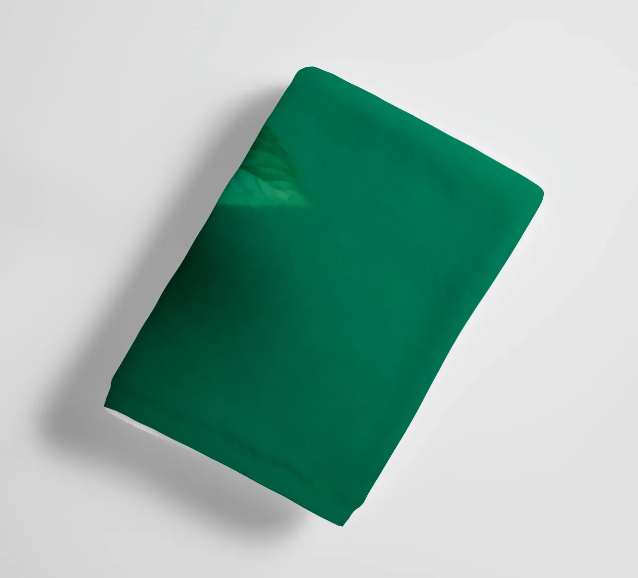 Lush green leaves create a backdrop in a calming nature towel by DesignDoodle