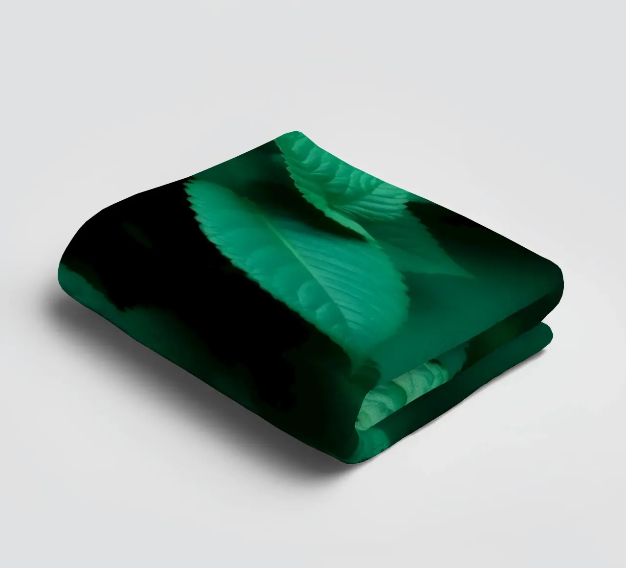 Lush green leaves create a backdrop in a calming nature towel by DesignDoodle
