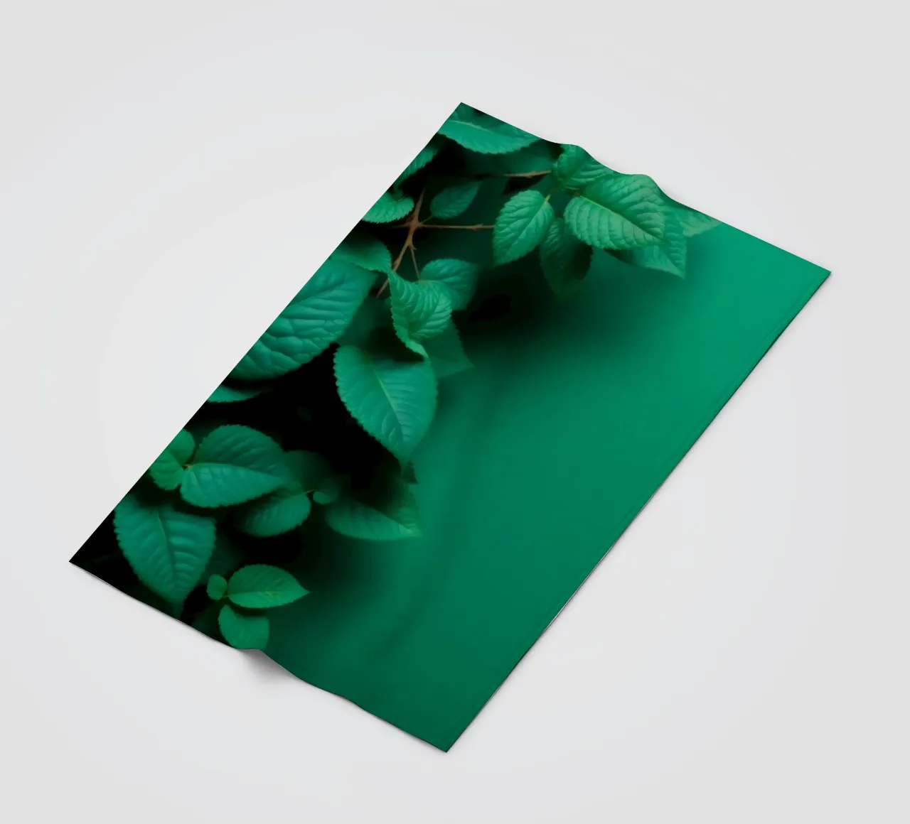 Lush green leaves create a backdrop in a calming nature fleece blanket by DesignDoodle