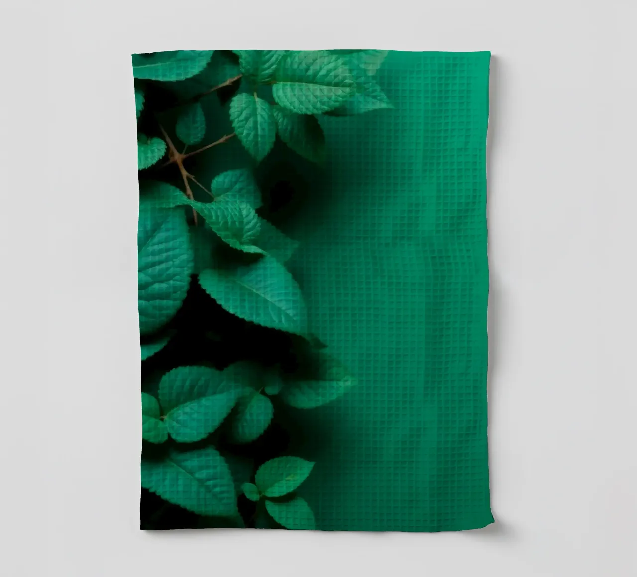 Lush green leaves create a backdrop in a calming nature tea towel by DesignDoodle