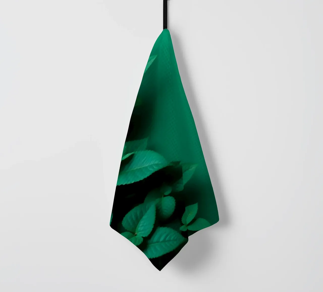 Lush green leaves create a backdrop in a calming nature tea towel by DesignDoodle