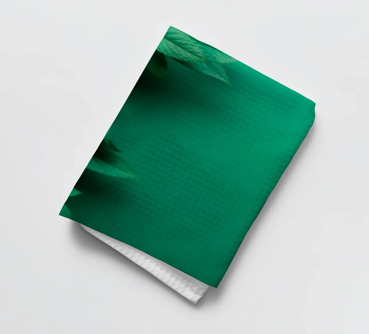 Lush green leaves create a backdrop in a calming nature tea towel by DesignDoodle