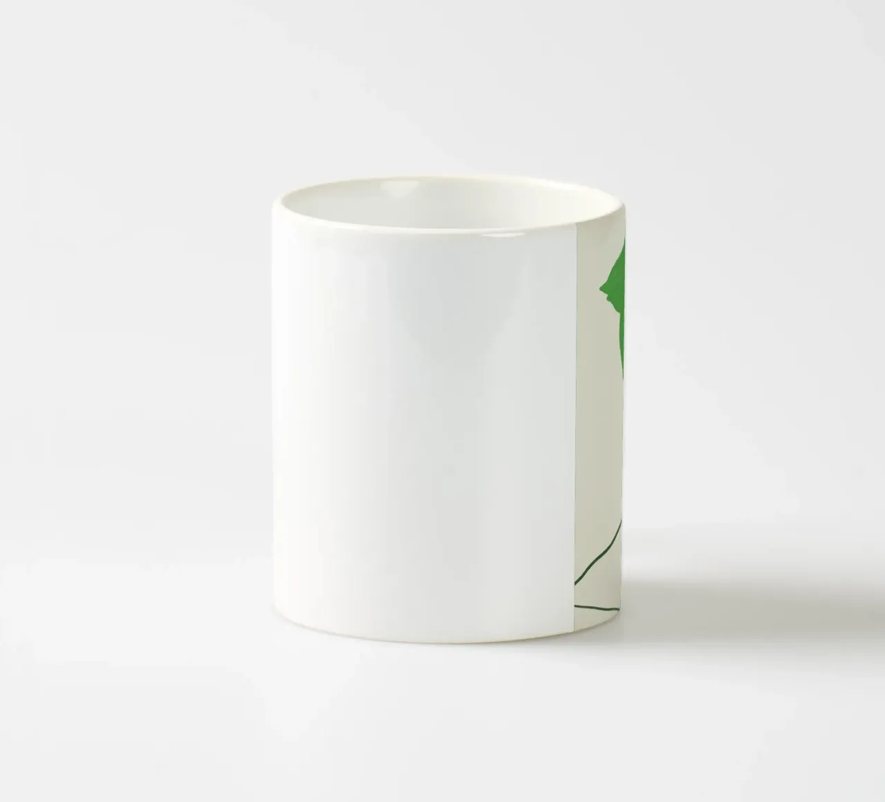 Foglie verdi sul tavolo tazza in ceramica da Little Dean