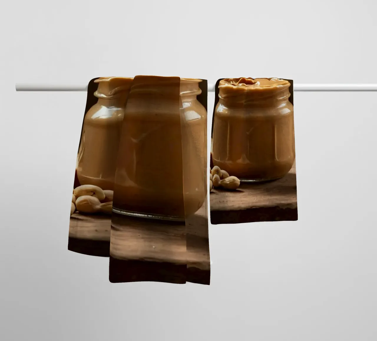 Delicious creamy peanut butter in a jar with sliced bread towel by DesignDoodle