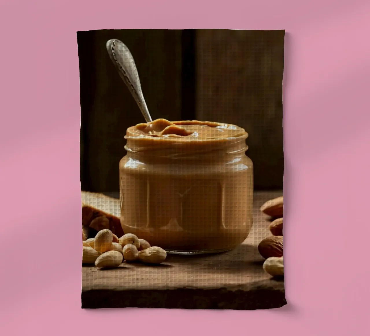 Delicious creamy peanut butter in a jar with sliced bread tea towel by DesignDoodle