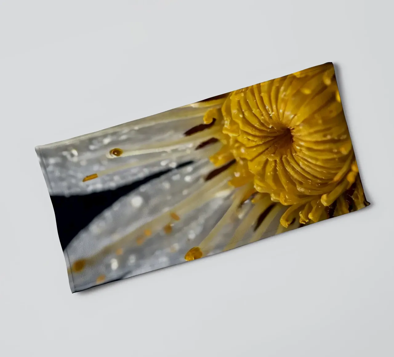 Close-up view of a water lily with dew drops on its petals towel by DesignDoodle