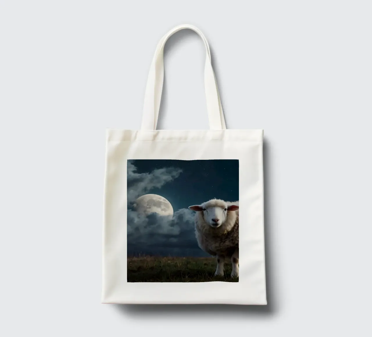 A sheep standing in a field under a bright moonlit sky tote bag by DesignDoodle