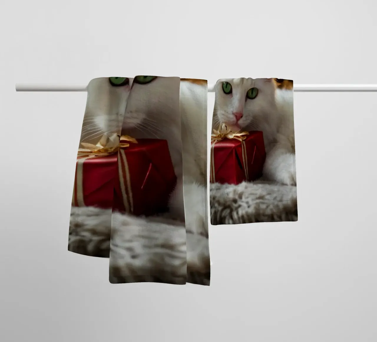 Two fluffy cats relaxing near a decorated Christmas tree towel by DesignDoodle