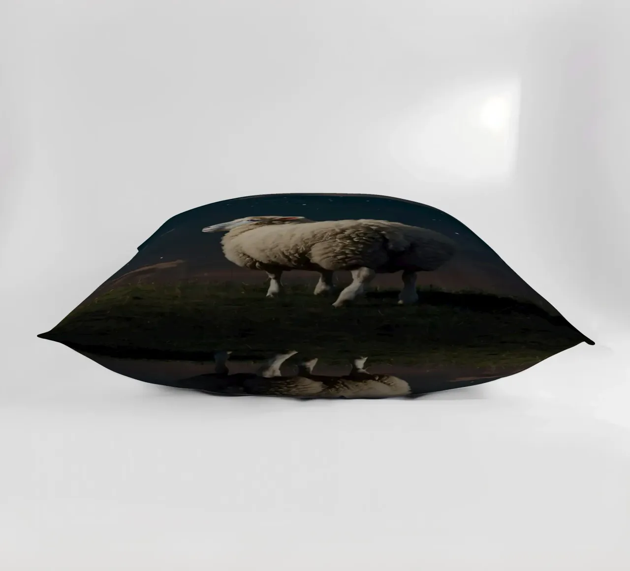 A lone sheep gazes at the bright full moon in a starlit sky decorative cushion by DesignDoodle