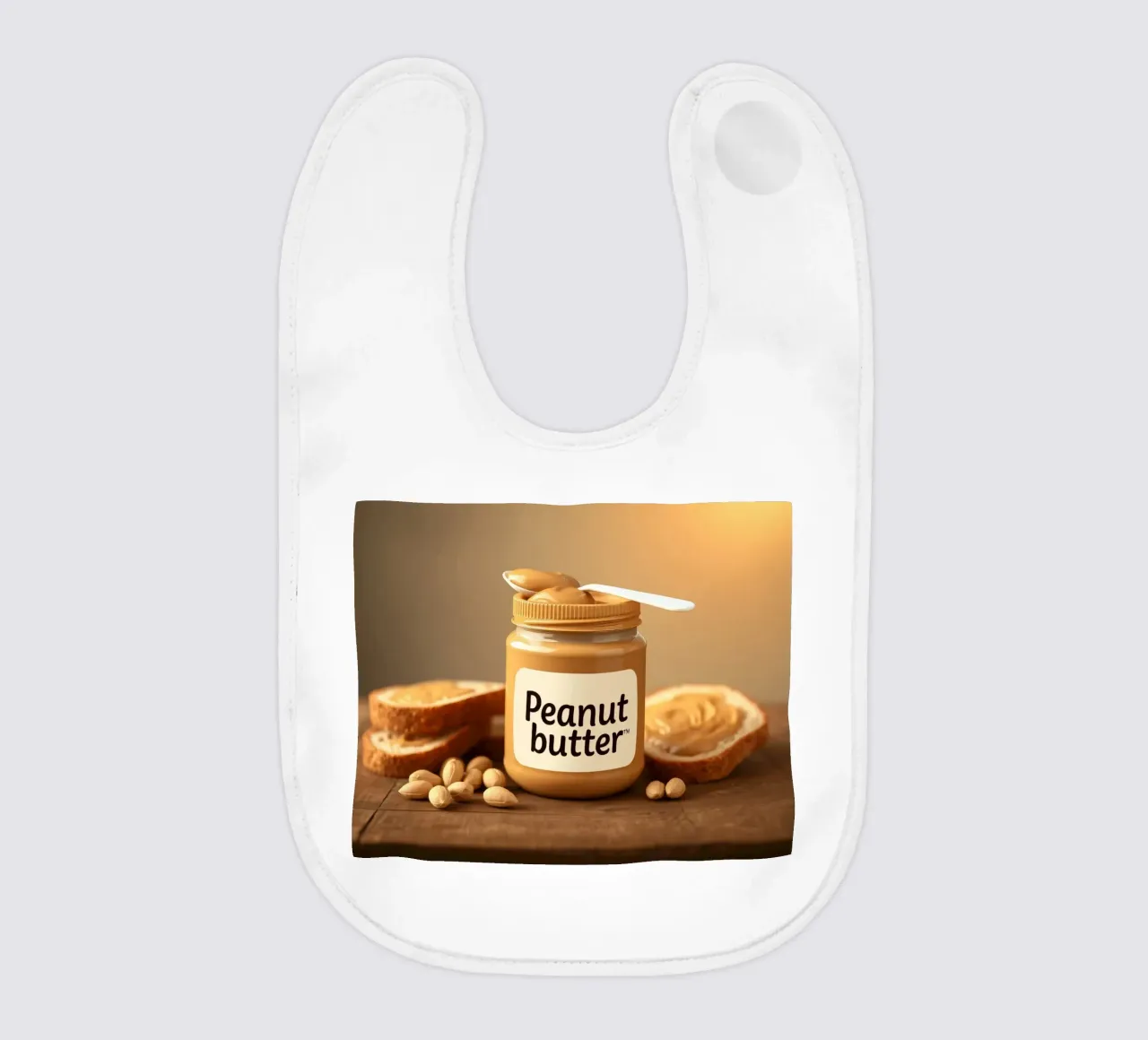 Delicious peanut butter jar with a spoon & slices of bread baby bib by DesignDoodle