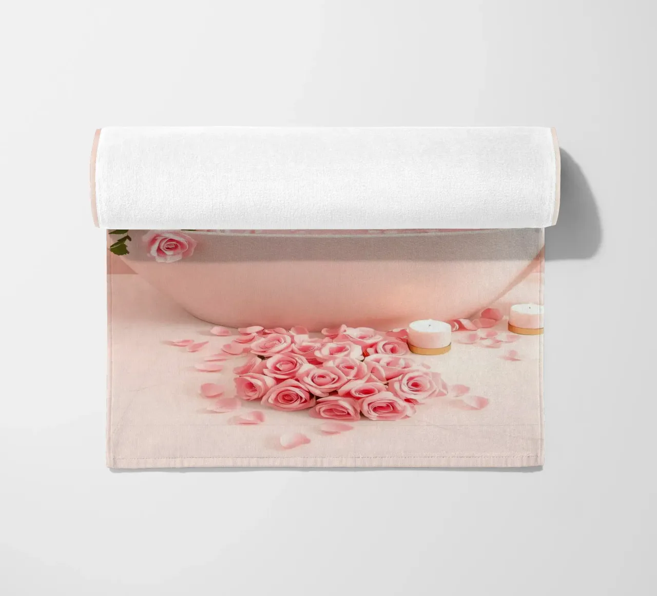 A relaxing bath adorned with pink roses and candles beach towel by DesignDoodle