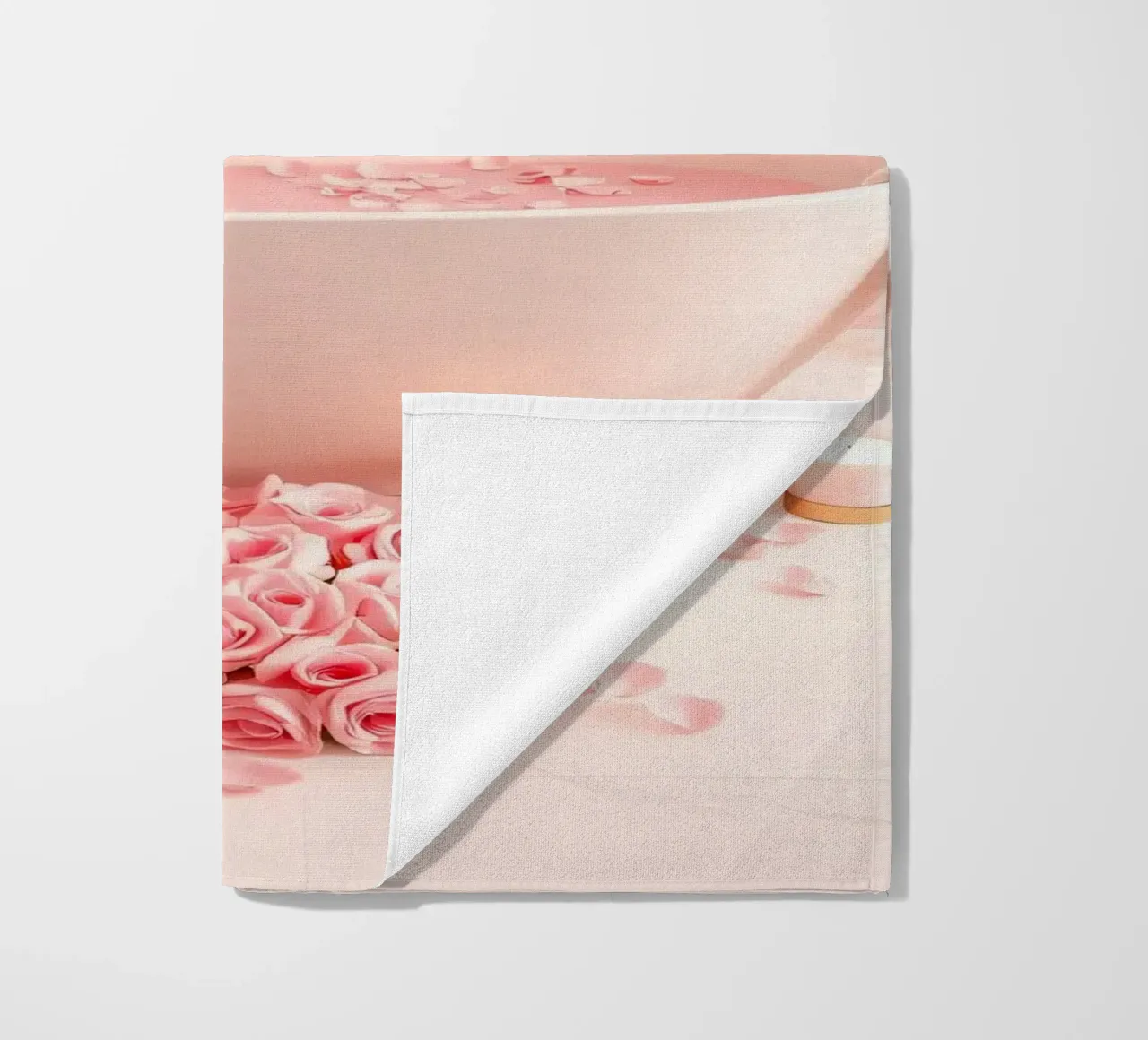 A relaxing bath adorned with pink roses and candles beach towel by DesignDoodle