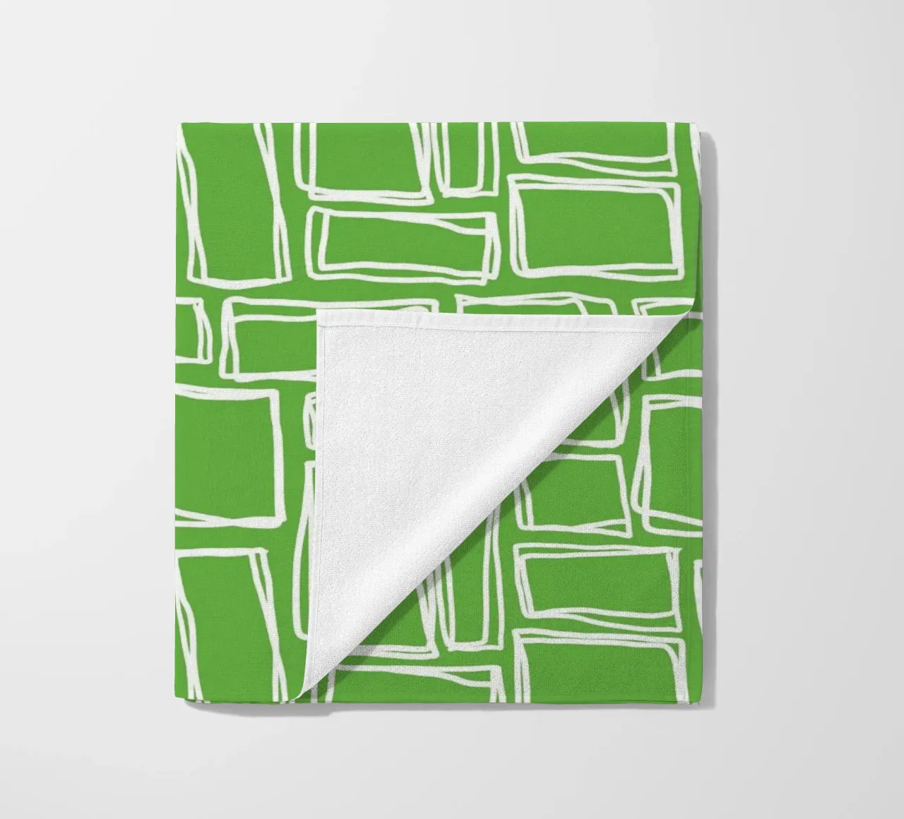 Quadrati Doodle in verde fresco telo mare da Happy Littles