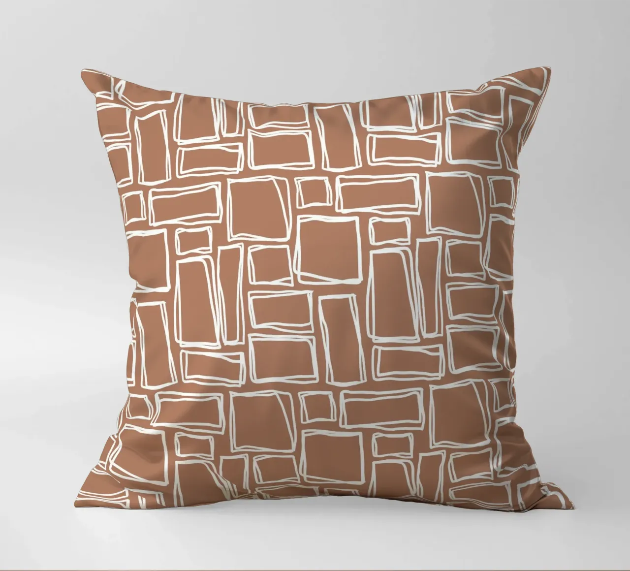 Quadrati Doodle in marrone argilla cuscino da Happy Littles