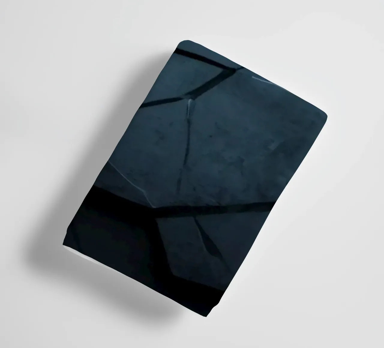 Dark cracked stone texture creates an abstract background towel by DesignDoodle