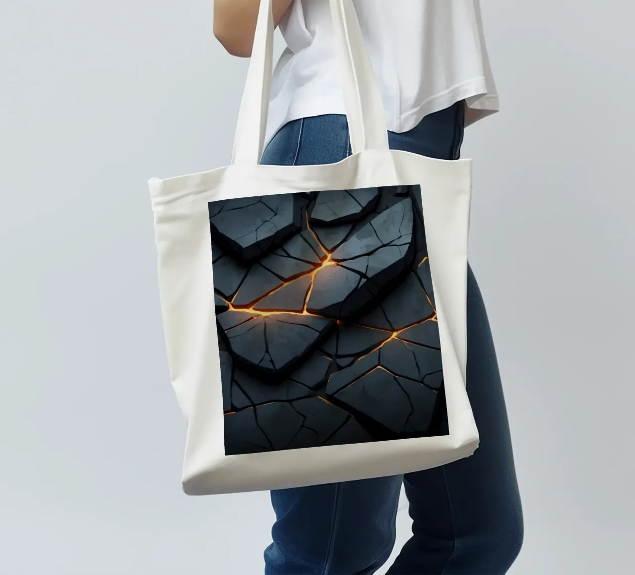 cracks in a dark surface create an intriguing abstract back tote bag by DesignDoodle