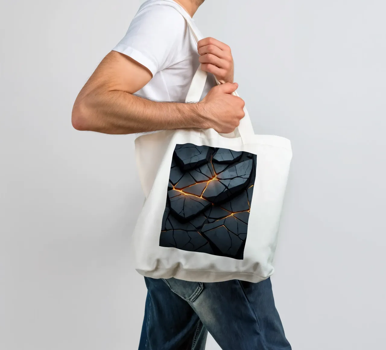 cracks in a dark surface create an intriguing abstract back tote bag by DesignDoodle