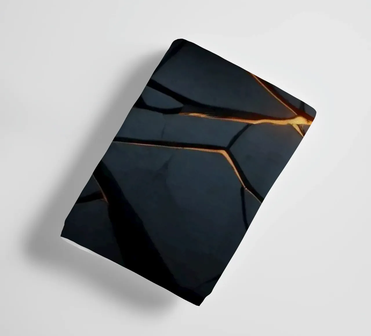 cracks in a dark surface create an intriguing abstract back towel by DesignDoodle