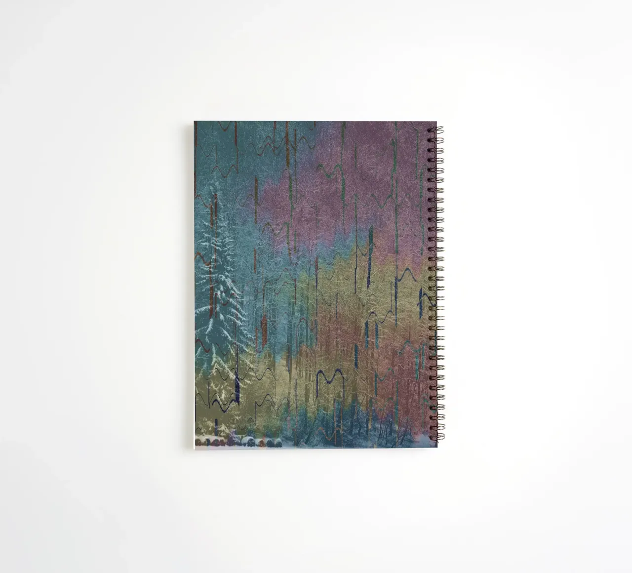 Two trees in winter against a colourful background spiral notebook by Something for you