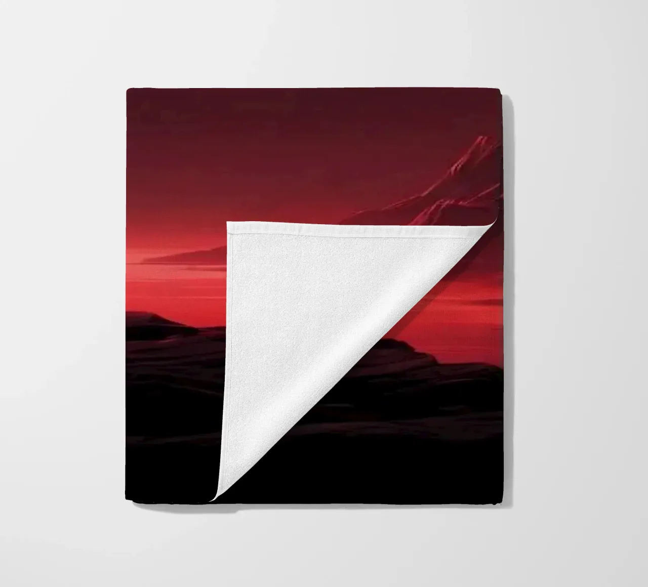 deep red tones background and shadowed mountains beach towel by DesignDoodle