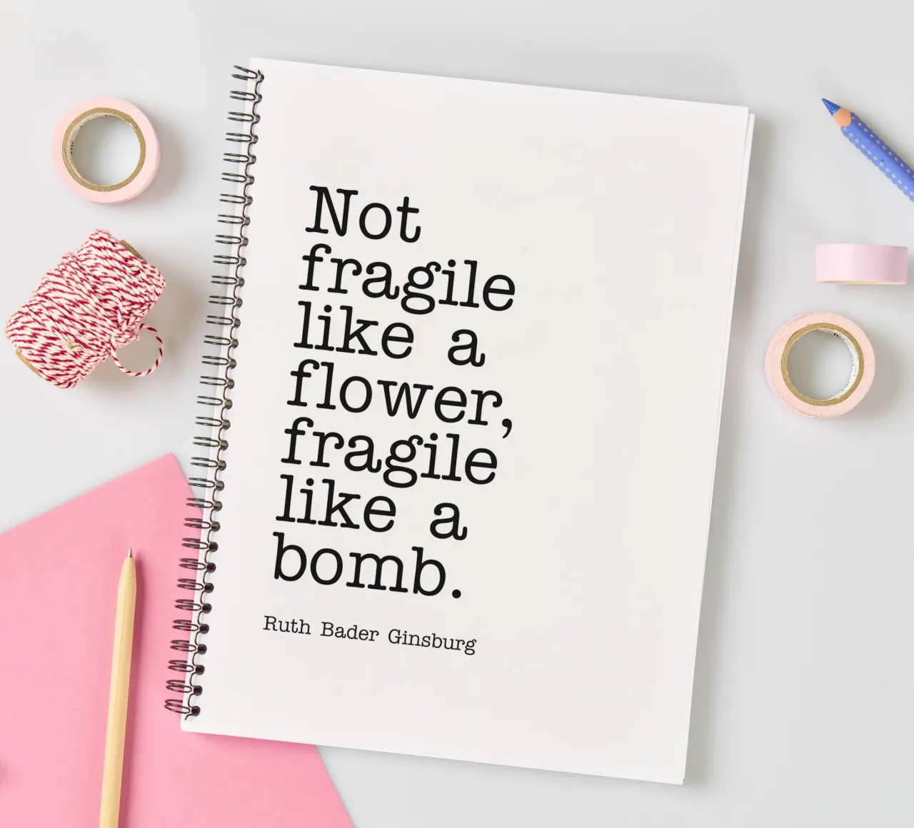 Not fragile like a flower, fragile like a bomb quote spiral notebook by Paigaam Studio