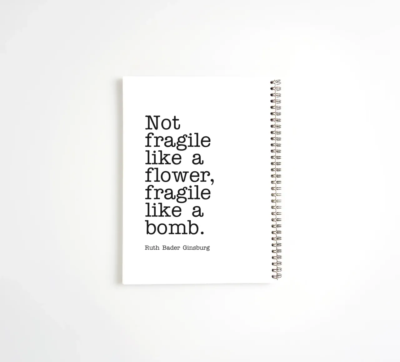 Not fragile like a flower, fragile like a bomb quote spiral notebook by Paigaam Studio