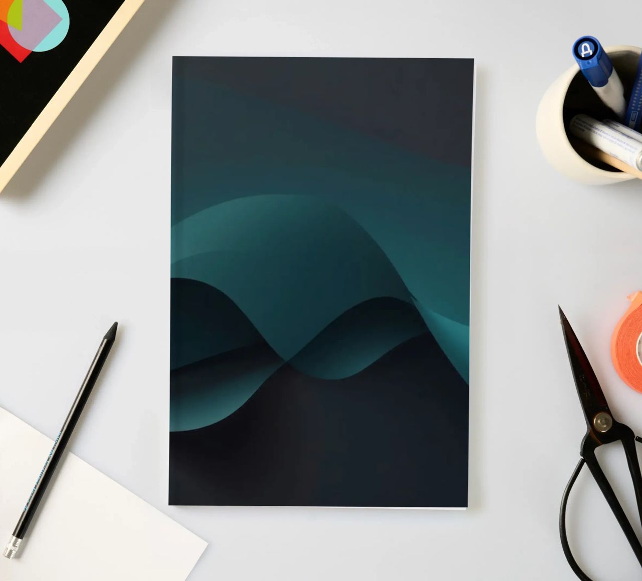 Smooth flowing curves of teal and dark shades create an eleg notebook by DesignDoodle