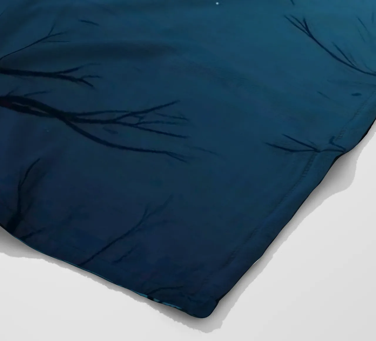 Ethereal night landscape featuring silhouetted trees fleece blanket by DesignDoodle