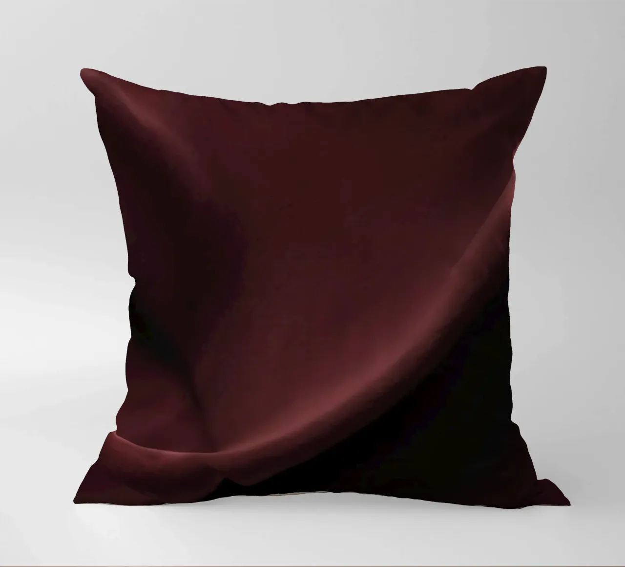 Elegant abstract background featuring smooth, flowing maroon decorative cushion by DesignDoodle