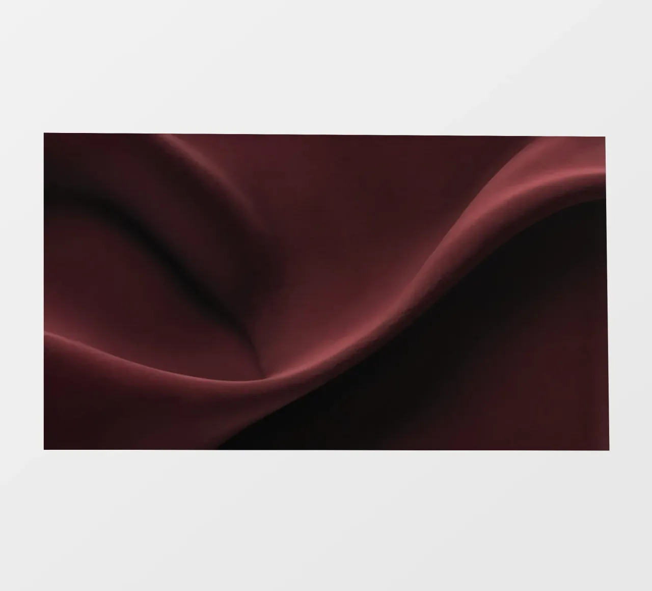 Elegant abstract background featuring smooth, flowing maroon backlit film by DesignDoodle