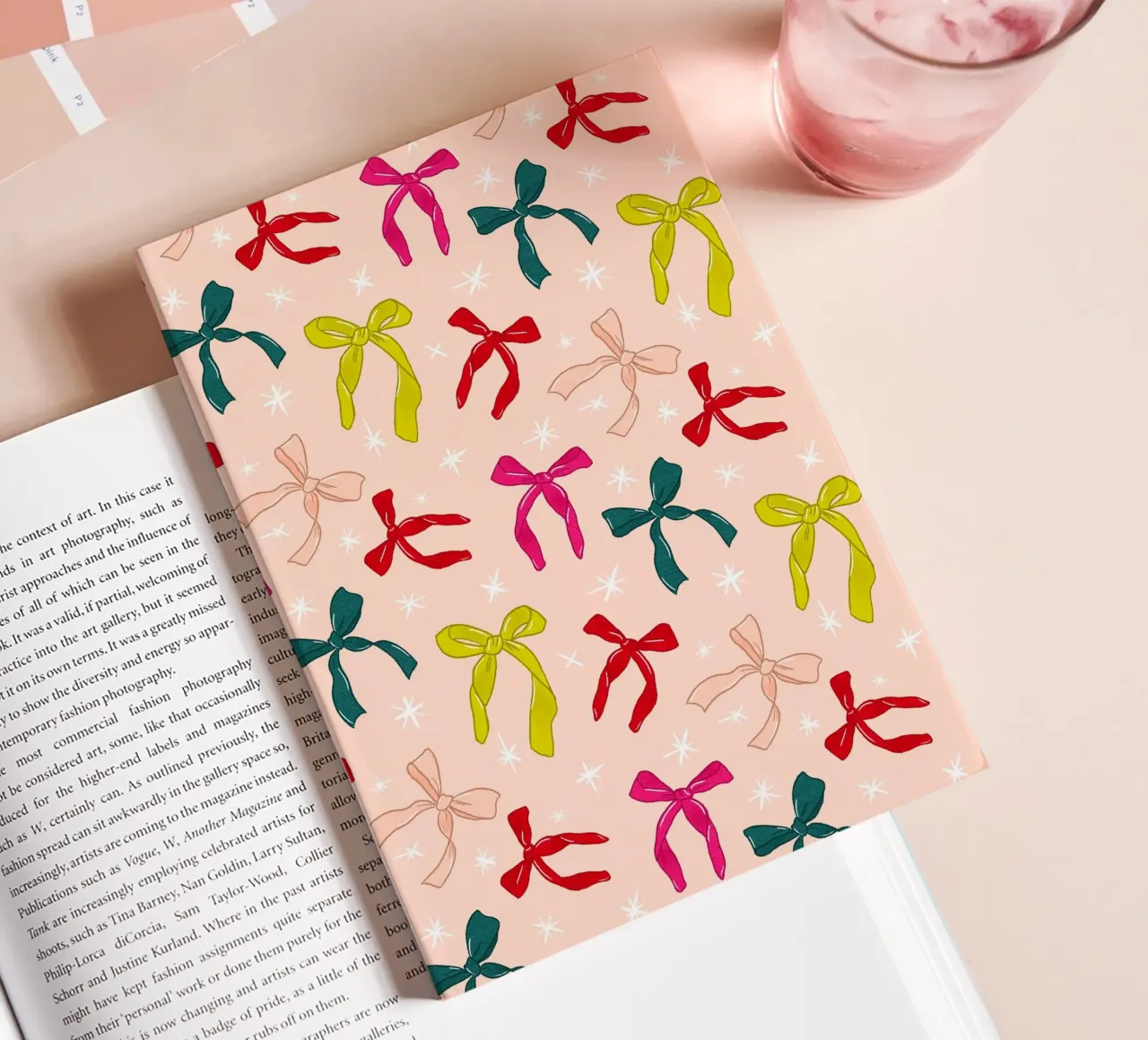 Colorful Bows Pattern on Soft Peach Background notebook by showmemars