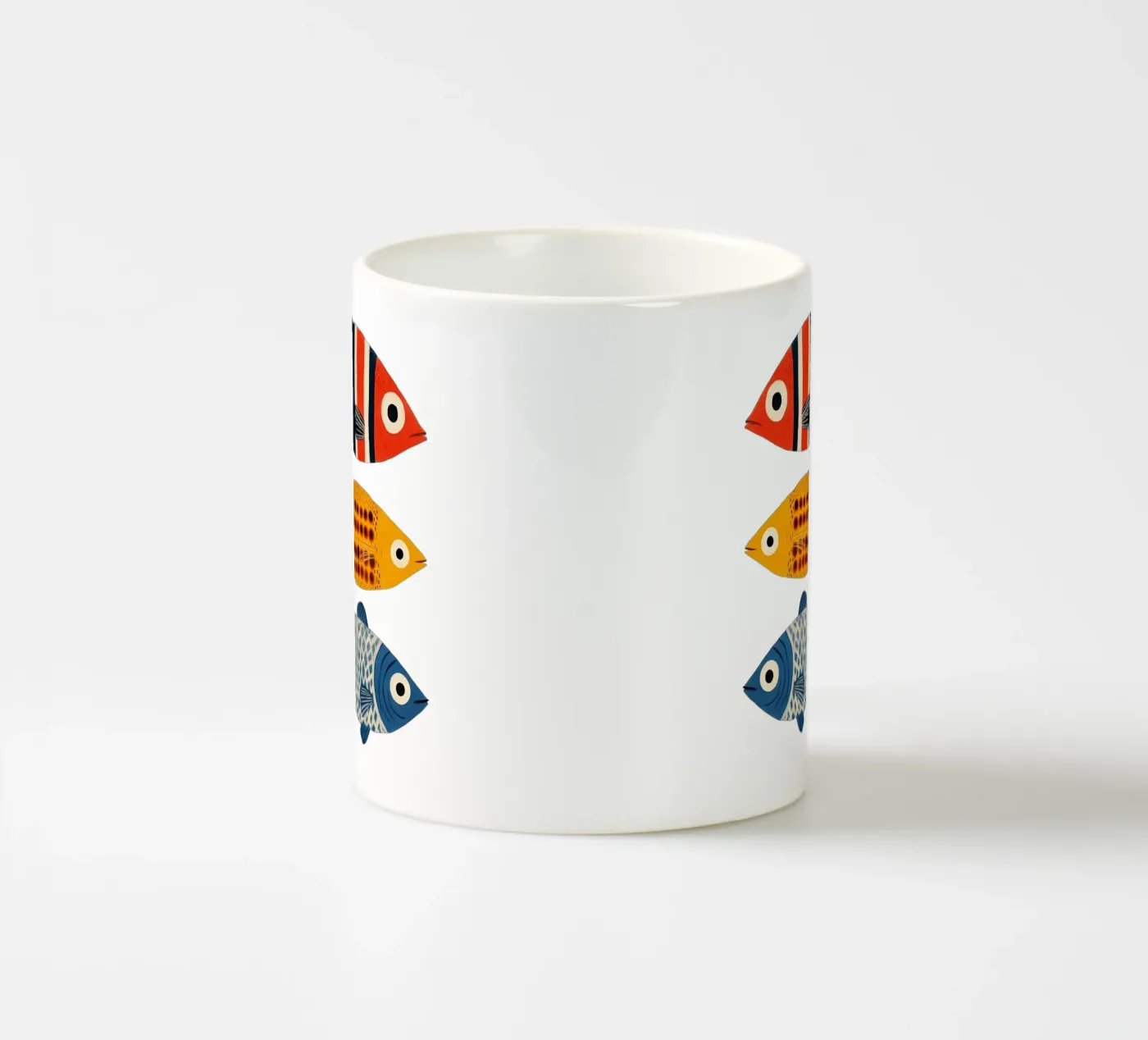 Three fish ceramic mug by Curious Canvas