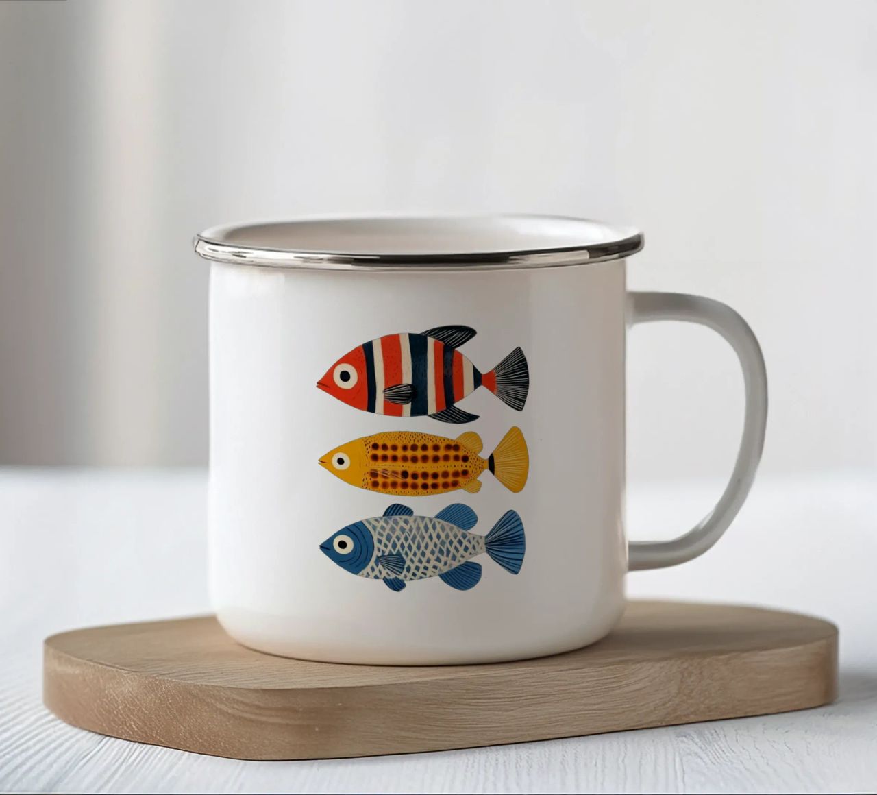 Tre pesci tazza in smalto da Curious Canvas