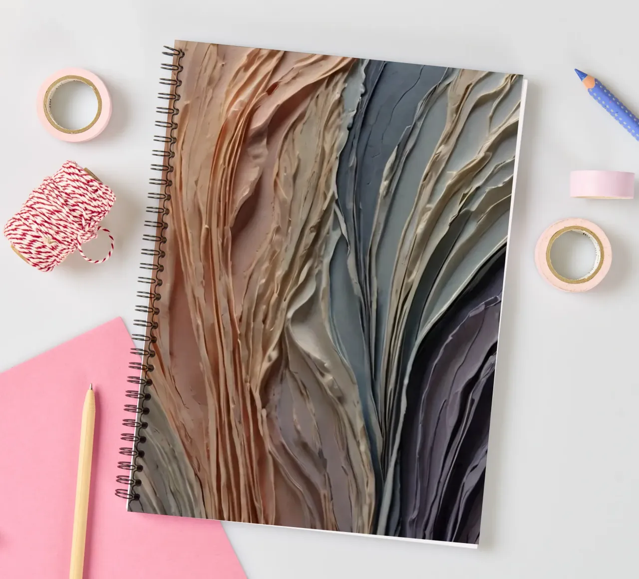 Abstract textured artwork showcasing layered paint in warm spiral notebook by DesignDoodle