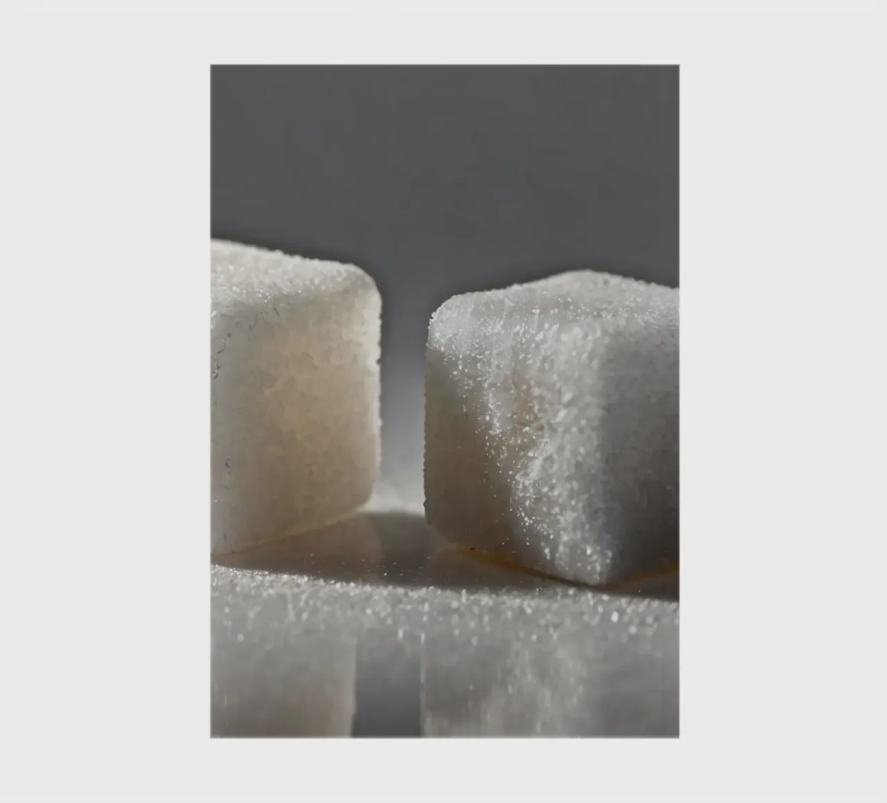 Two sugar cubes on a reflective surface with soft lighting notebook by DesignDoodle