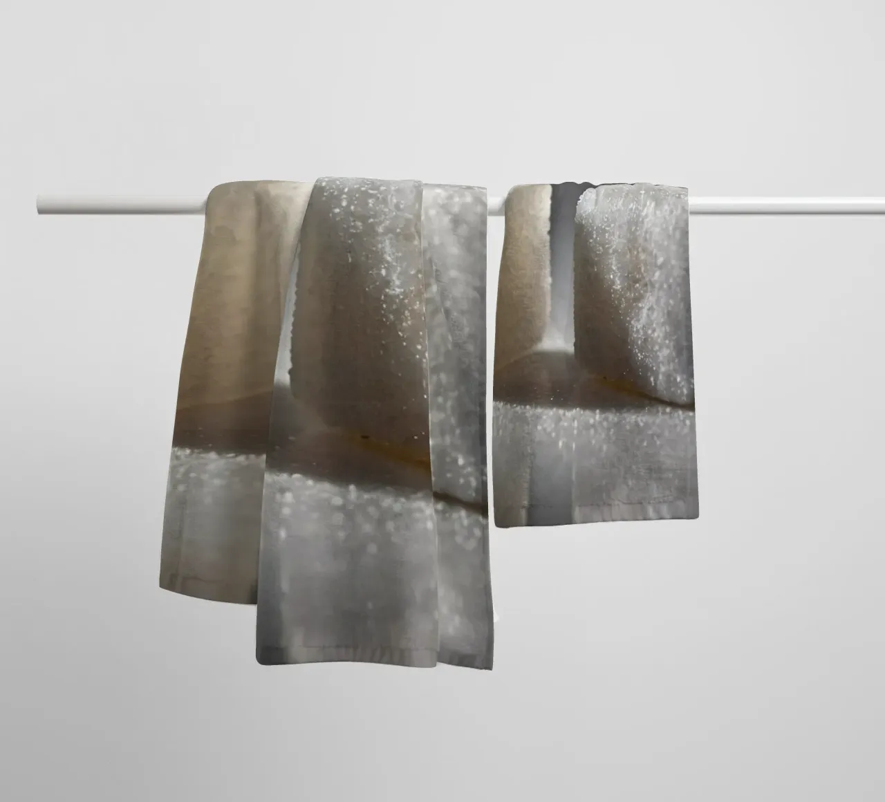 Two sugar cubes on a reflective surface with soft lighting towel by DesignDoodle