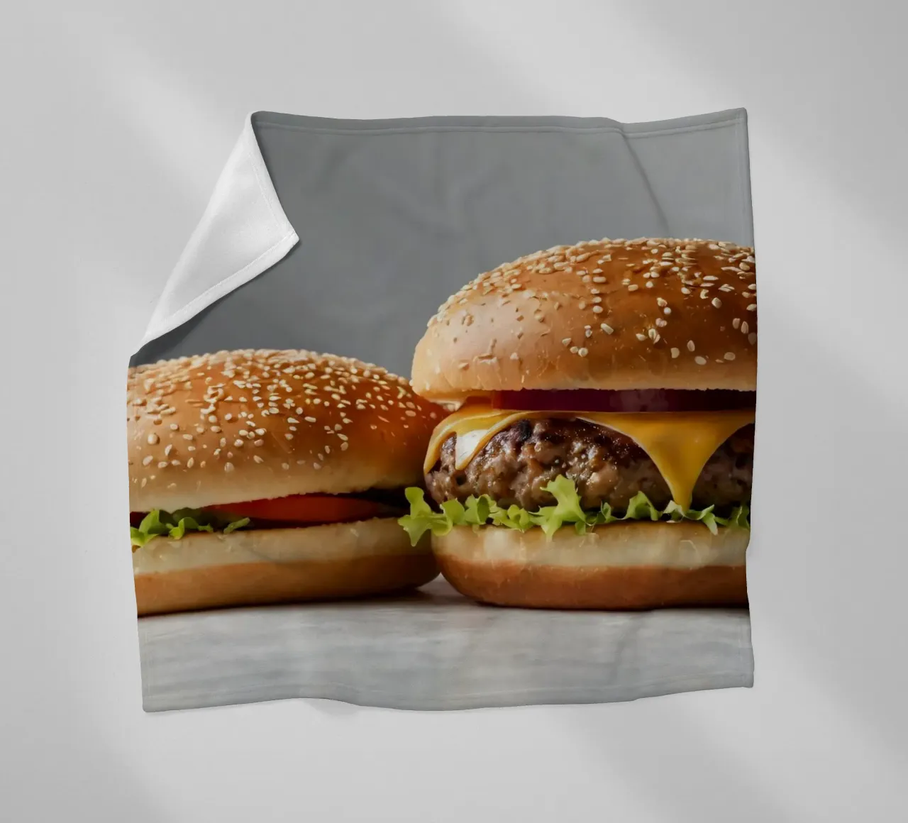 Delicious cheeseburger and simple hamburger on a countertop fleece blanket by DesignDoodle