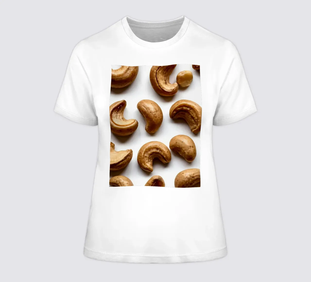 Raw cashew nuts arranged on a white surface for healthy snac women's fitted t-shirt by DesignDoodle
