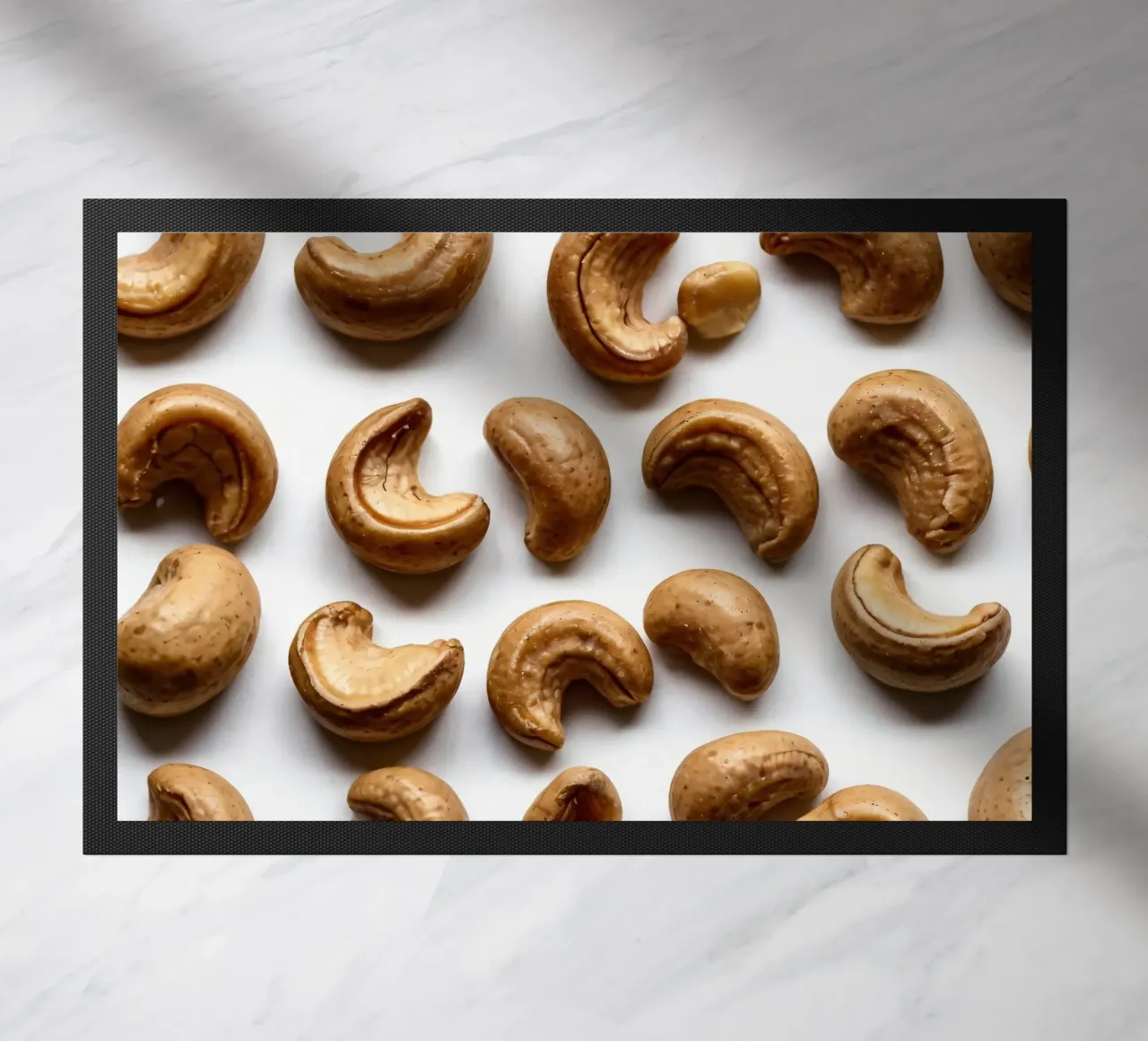 Raw cashew nuts arranged on a white surface for healthy snac doormat by DesignDoodle