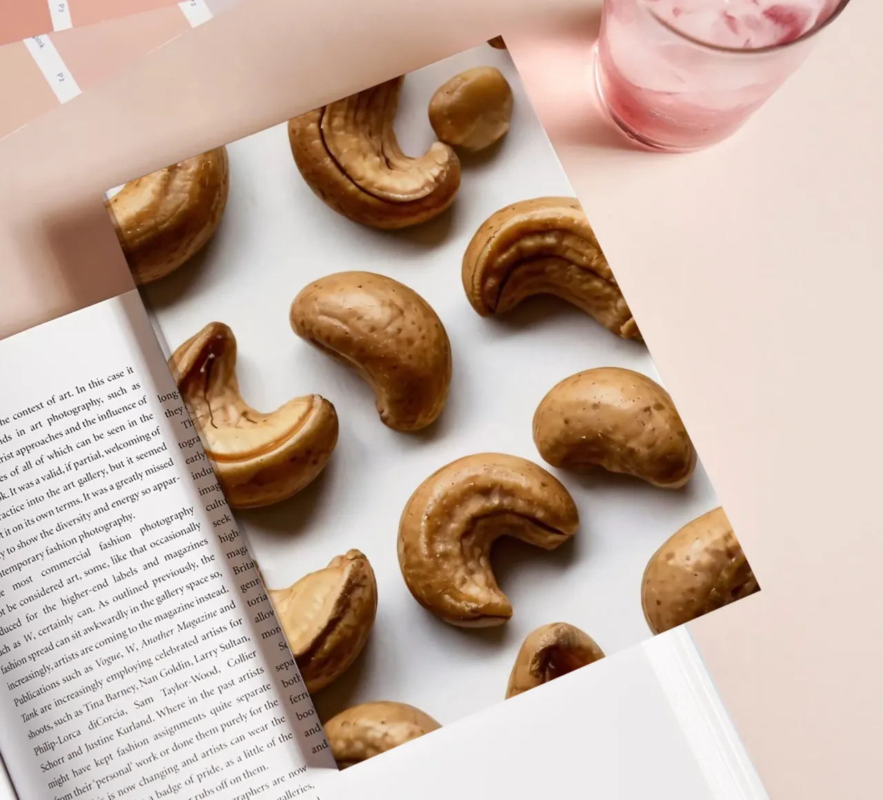 Raw cashew nuts arranged on a white surface for healthy snac notebook by DesignDoodle