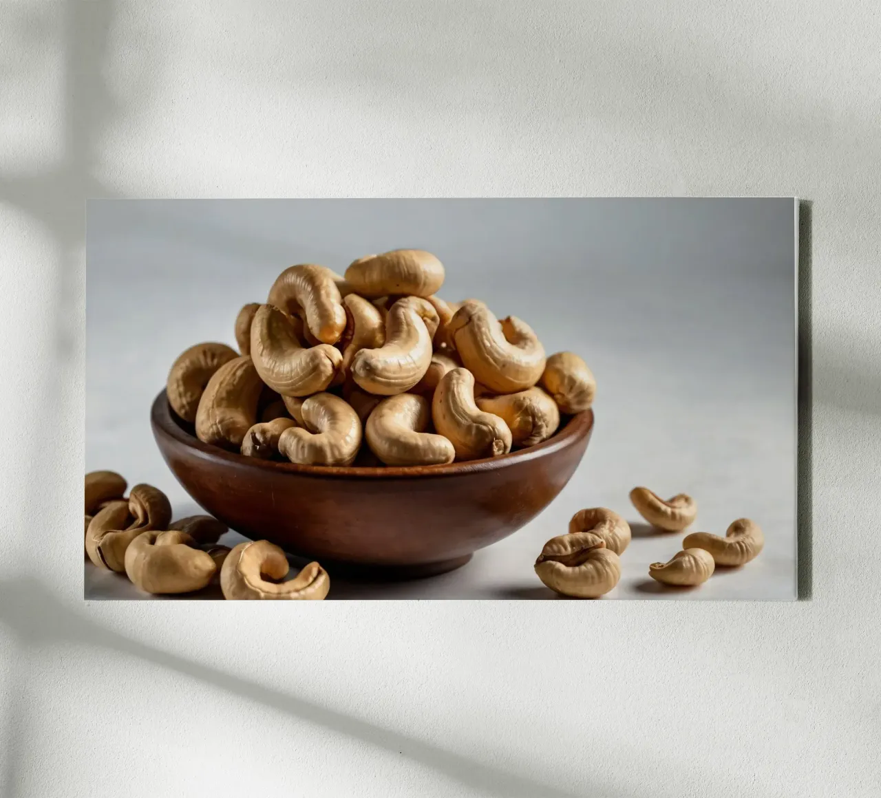 Raw cashew nuts arranged on a white surface for healthy snac canvas by DesignDoodle