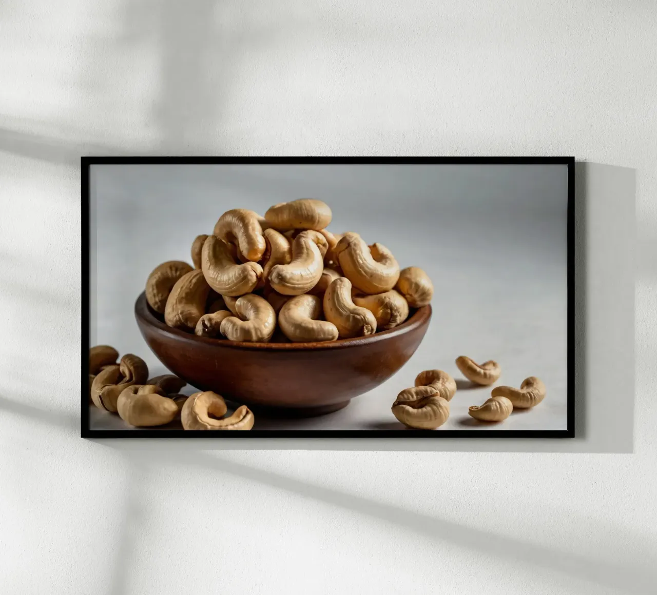 Raw cashew nuts arranged on a white surface for healthy snac hahnemühle by DesignDoodle