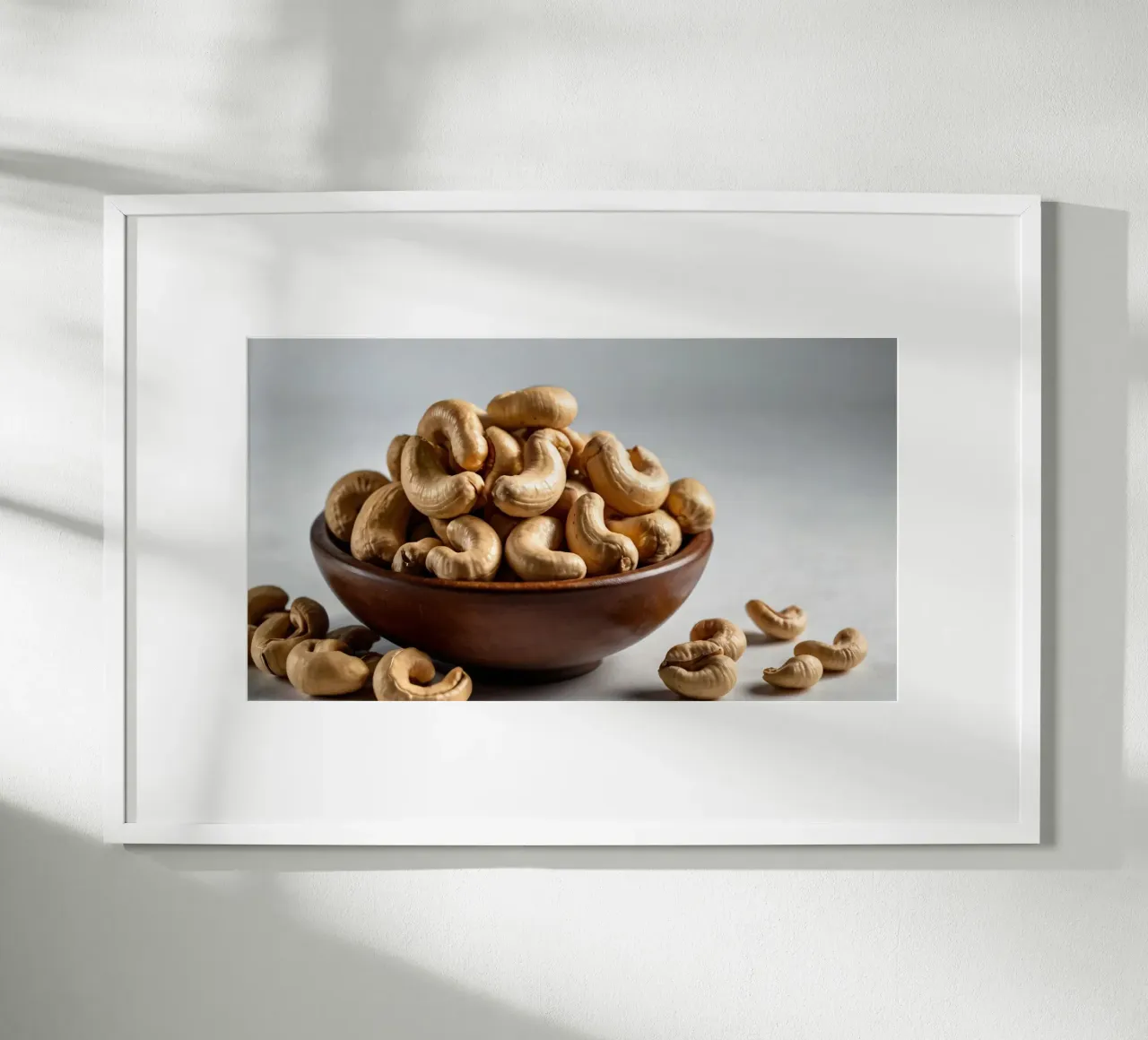 Raw cashew nuts arranged on a white surface for healthy snac hahnemühle by DesignDoodle