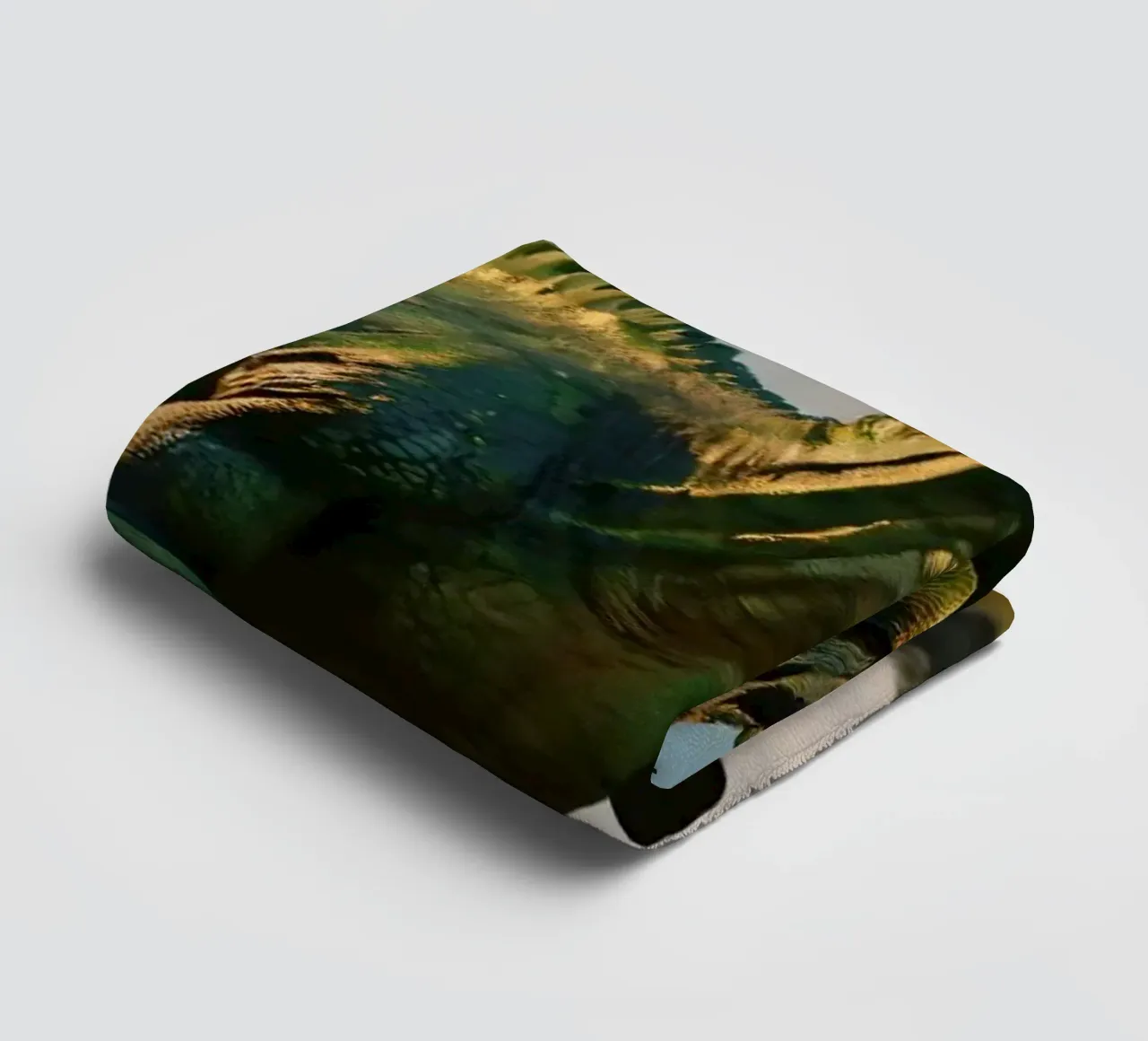 A realistic dinosaur stands in a lush landscape towel by DesignDoodle