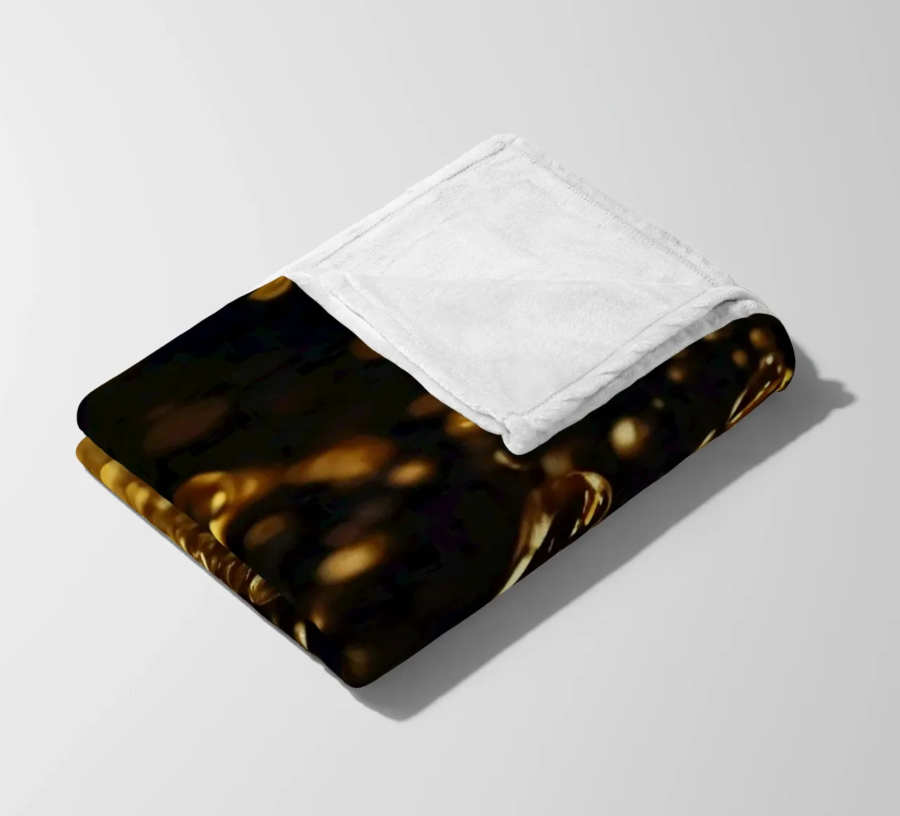 Gocce d'oro brillano su una superficie scura con un bokeh ipnotico coperta in pile da DesignDoodle