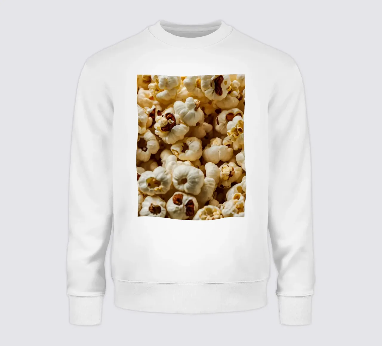 Plain popcorn kernels scattered in a bowl, ready for snackin sweatshirt by DesignDoodle