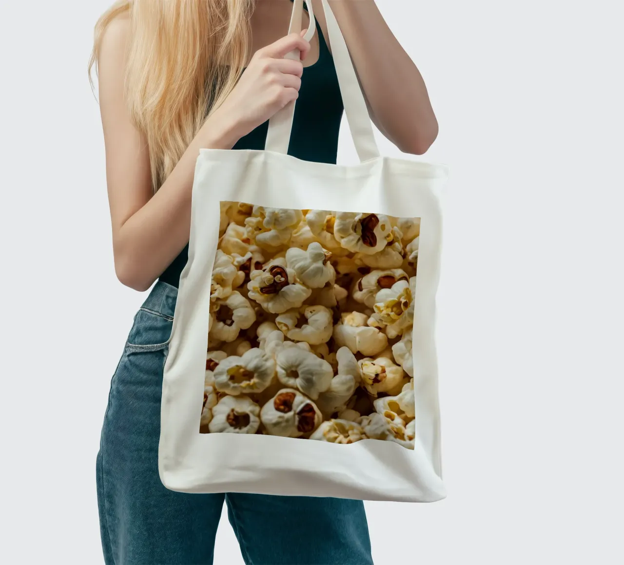 Plain popcorn kernels scattered in a bowl, ready for snackin tote bag by DesignDoodle