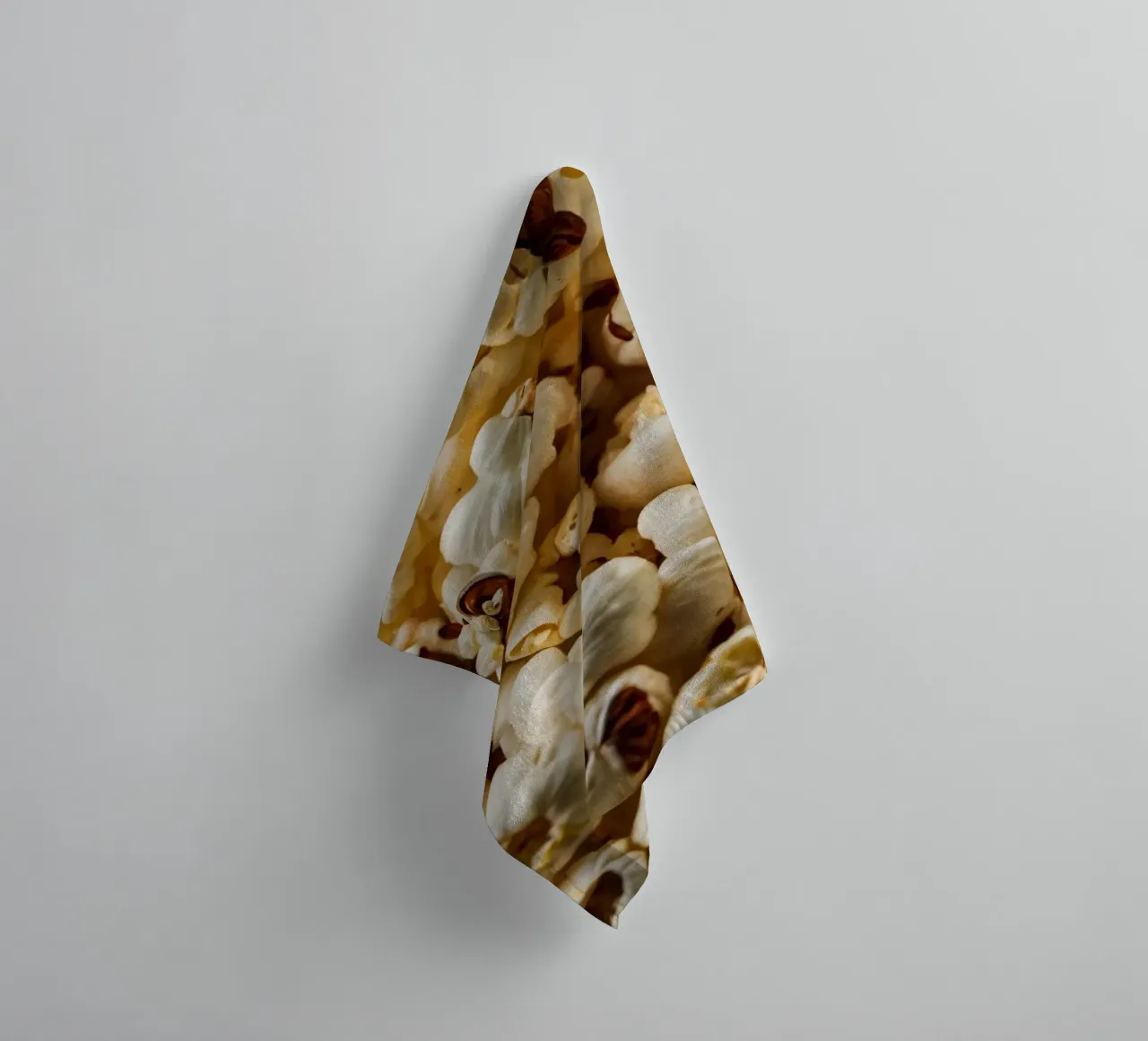 Plain popcorn kernels scattered in a bowl, ready for snackin towel by DesignDoodle