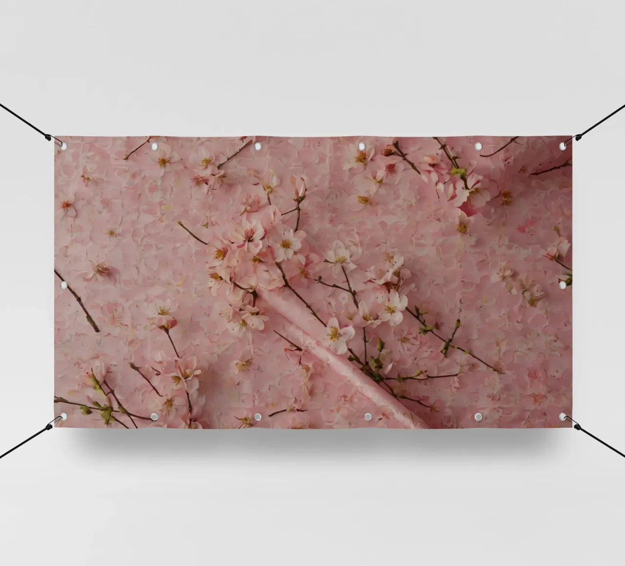 Delicati fiori di ciliegio rosa disposti su un tappeto rosa tenue telo in pvc da DesignDoodle