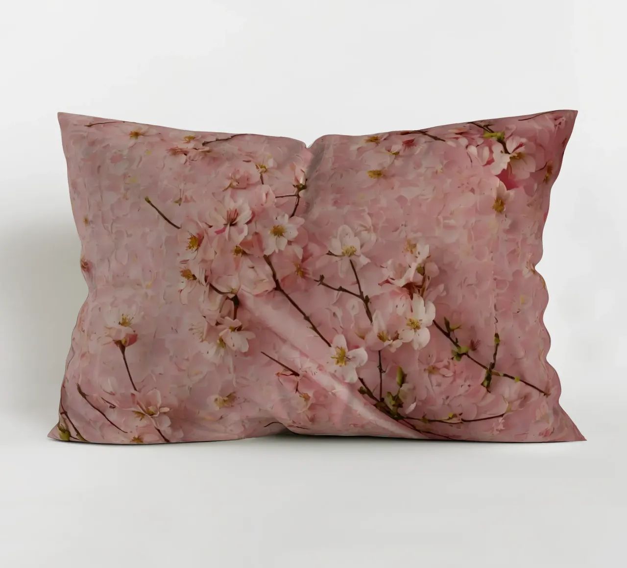Delicati fiori di ciliegio rosa disposti su un tappeto rosa tenue cuscino da DesignDoodle